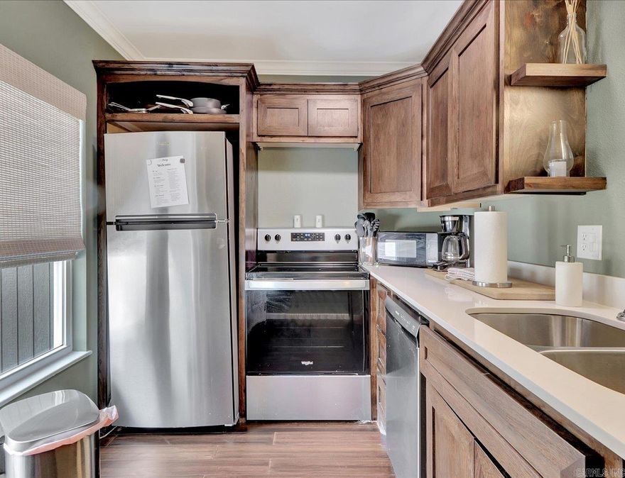 BEAUTIFUL LAKE VIEW CONDO. Currently an active short-term rental.  Enjoy an open floor plan with breathtaking views of Lake Hamilton and the surrounding mountains. With modern updates throughout, this condo offers a seamless living experience.  Ideal for both investment and personal retreat, this condo has everything you need for a relaxing and enjoyable stay. COME AND SEE!   Agents - Call Showing service to schedule all showings.