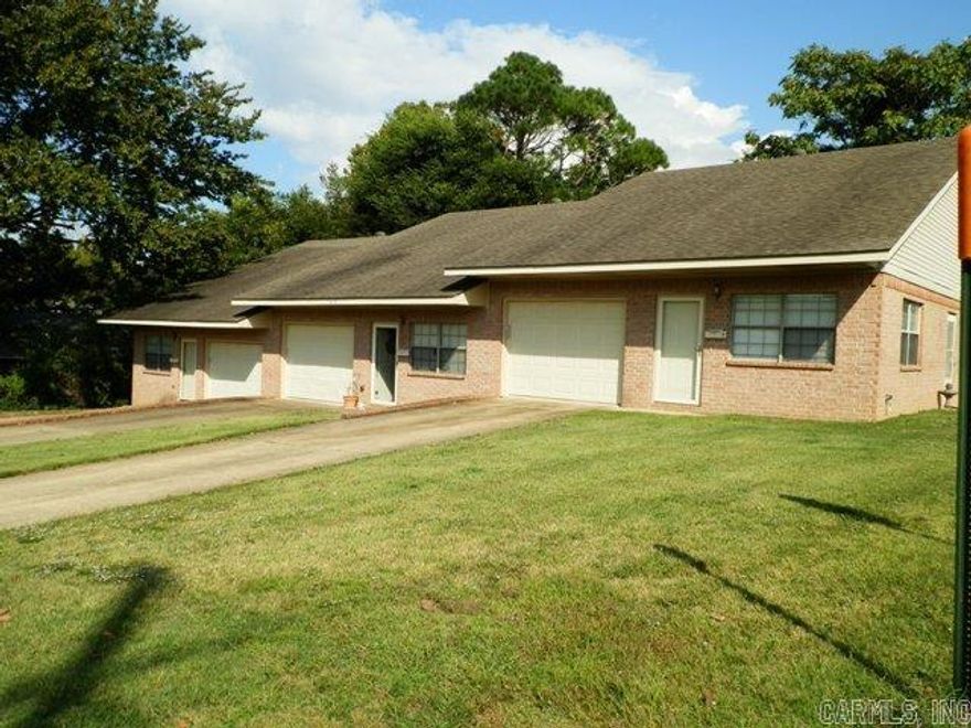 Brick triplex unit located near hospital, restaurants, schools. Refrigerator, electric stove, dishwasher, garbage disposal provided. One bath has step-in shower. Other bath has standard tub with shower. Washer, dryer hookups in one-car garage. Tenant responsible for all utilities. Wired for fiber optic internet. No pets. Not currently approved for HUD Section 8. Application required. Nonrefundable application fee charged. Apply with listing office.