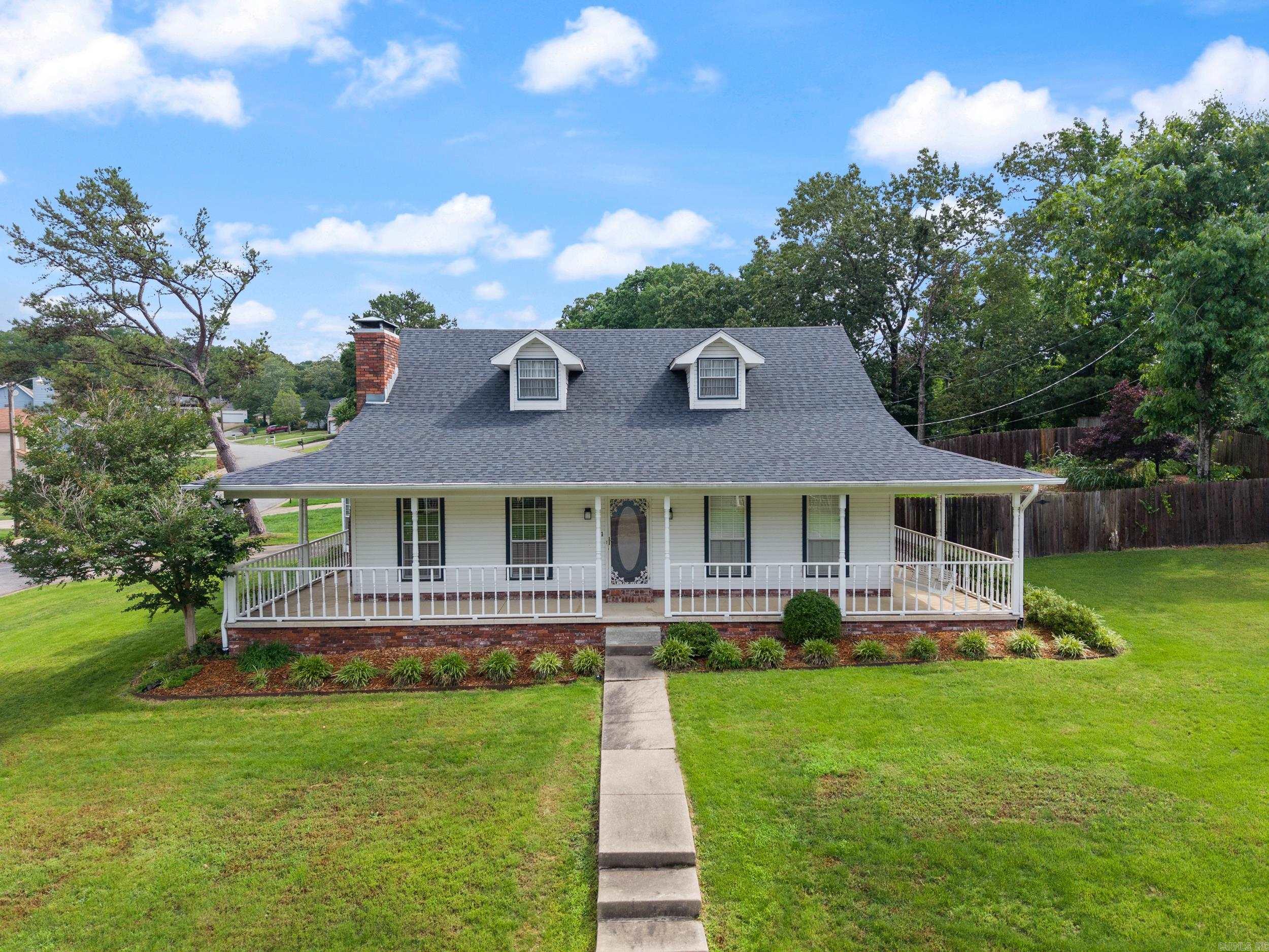 Welcome to this beautifully maintained 3-bedroom, 2-bathroom traditional family home located in the desirable Sandpiper subdivision of Little Rock. Situated on a spacious corner lot with mature landscaping, this 1,680 sq ft home offers a perfect blend of comfort, style, and functionality. Step onto the inviting wrap-around porch and into a warm, welcoming interior featuring a large kitchen with ample counter space and a walk-in pantry—ideal for home chefs and busy families alike. The heart of the home is a stunning brick fireplace, perfect for cozy evenings in the generously sized living area. The primary suite offers privacy and convenience, while two additional bedrooms provide plenty of space for family, guests, or a home office. Step outside to the back deck and enjoy a custom-designed entertainment area—ideal for relaxing, grilling, and hosting friends and family. Additional features include a two-car side-entry garage, lush landscaping, and access to outstanding neighborhood amenities including a swimming pool and tennis courts. Don’t miss this opportunity to own a classic, move-in ready home in one of Little Rock’s most sought-after communities!
