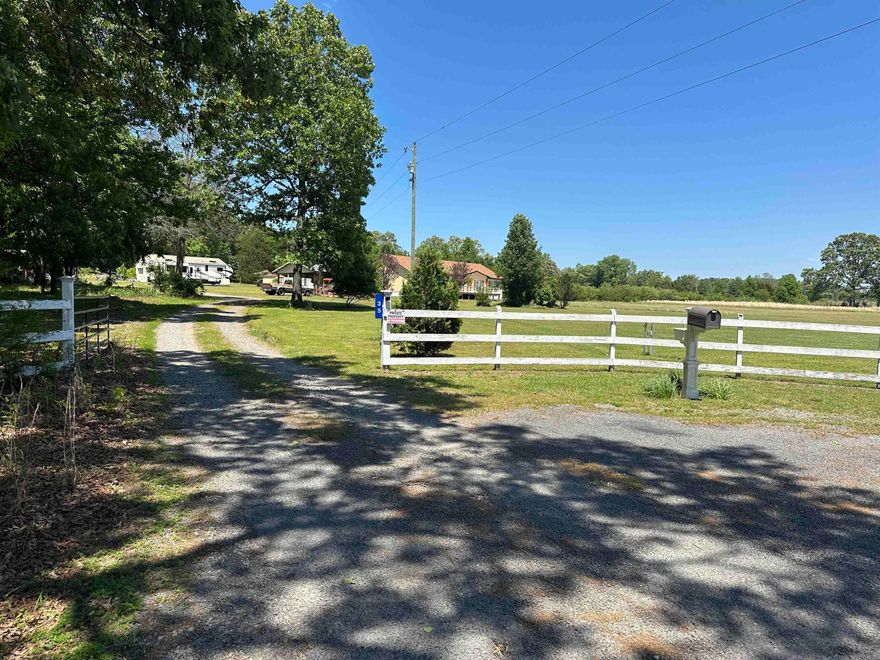 You will fall in love with this home as soon as you see it. This home is at the end of the road and secluded. The home offers 3 spacious bedrooms and 2 full baths, New 2026 HVAC and water heater. The roof is only 10 years old. There is a huge pantry and an office for your convenience. There is also an office and a full bathroom in the 30x40 shop. You have the convenience of city water but also the luxury of a deep artesian well. There are two storm shelters next to the home. The newer one is a 8x8 wheelchair accessible storm shelter that could have electric ran to it. The property is completely fenced in but there is a nice fence in the back yard with a beautiful deck to enjoy your morning coffee on. There are 3 septics on the property. Both carports on the property does convey. There is a huge gravel pad ready for you to build a second shop. Plus the sellers have an assumable loan of 2.125%. The home is a well maintained modular on a permanent foundation.