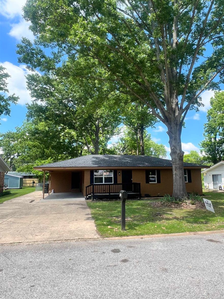 Beautifully remodeled 3 bedroom, 1 bath home in a quiet neighborhood!  New plumbing, electrical, sheetrock, windows, roof, HVAC, cabinets, etc! Nice storage building. New cabinets & countertops. Refrigerator conveys.