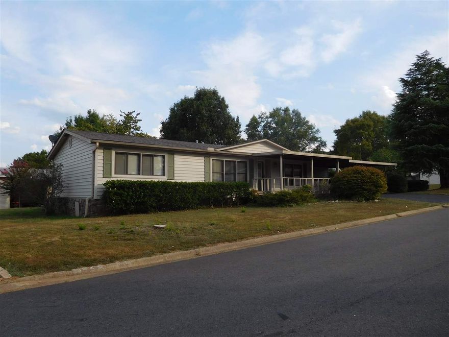 NICE AND WELL MAINTAINED 3BR 2BA in SOUTHWOOD 55+ COMMUNITY!  This home is on a corner lot, has a double carport and attached storage building, fenced area for your pet + a Hobby Room!  The home is well insulated, low maintenance, and interior is loaded with extras including fireplace with gas logs, vaulted ceilings, dining room with built-in hutch, newer appliances in kitchen + washer/dryer.  Southwood has a low POA fee and offers residents a Community Room, Swimming Pool and on-site storage for boats/RVs.