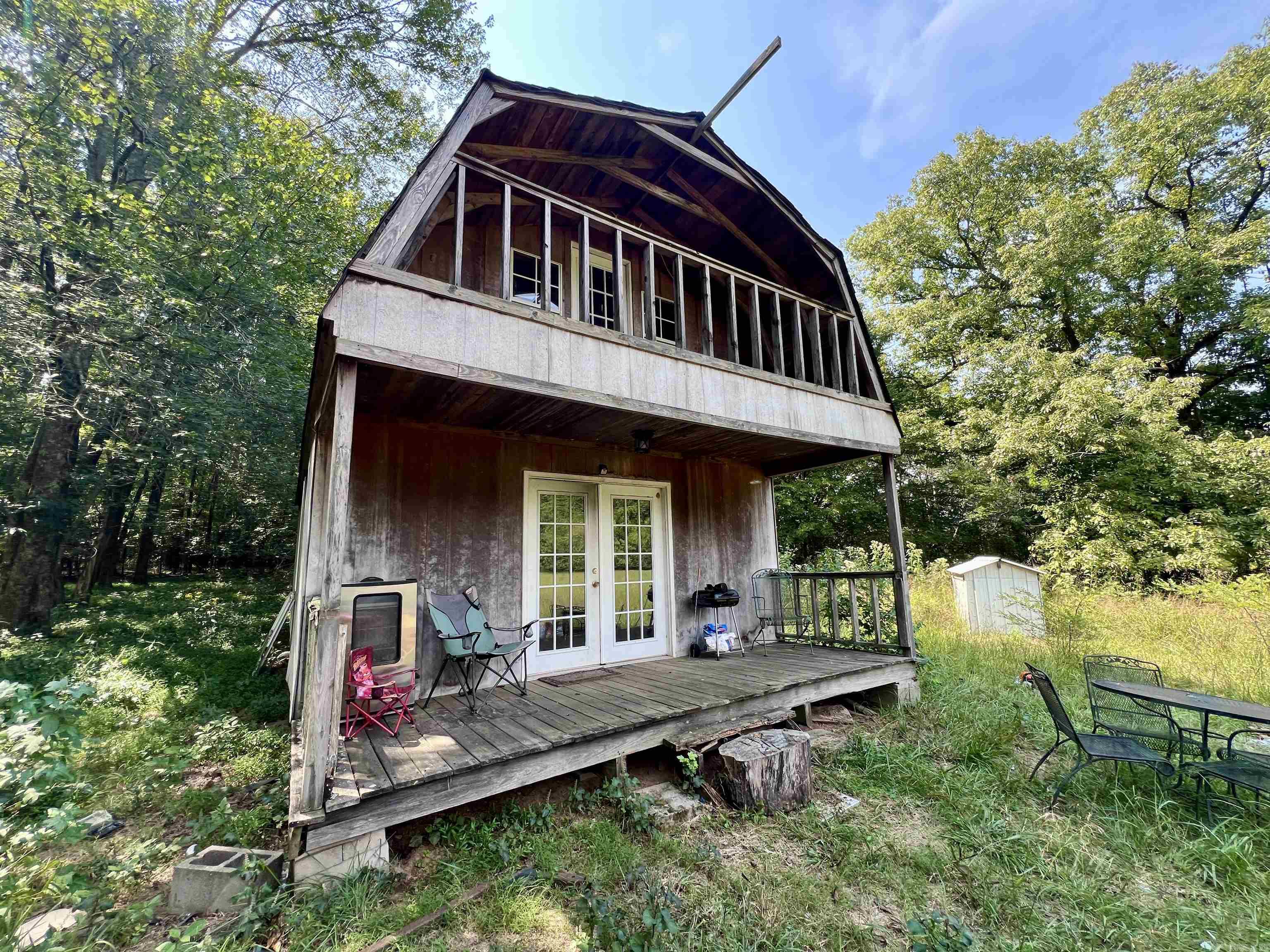 Rustic Cabin Retreat Near Wolf Pen Gap Trails & Talimena Scenic Byway Discover your own private getaway in the heart of the Ouachita Mountains. This gambrel-style cabin, complete with a covered front porch and walk-out balcony for soaking in the views. Set on 7.76 level acres of open and wooded land, the property sits along the Sugar Creek branch of the Cossatot River and is surrounded by the Ouachita National Forest, home to deer, turkey, black bear, fox, and other native wildlife. The location is ideal for outdoor adventure: Wolf Pen Gap Trail System and Ouachita National Forest ā 400+ miles of ATV/Off-Highway trails; Talimena Scenic Byway (Skyline Drive) ā renowned for breathtaking mountain vistas; Endless opportunities for hiking, hunting, and exploring nature Whether youāre looking for a weekend retreat, full-time residence, or income-producing vacation rental, this property combines rustic charm, acreage, and proximity to some of Arkansasās most popular outdoor destinations.