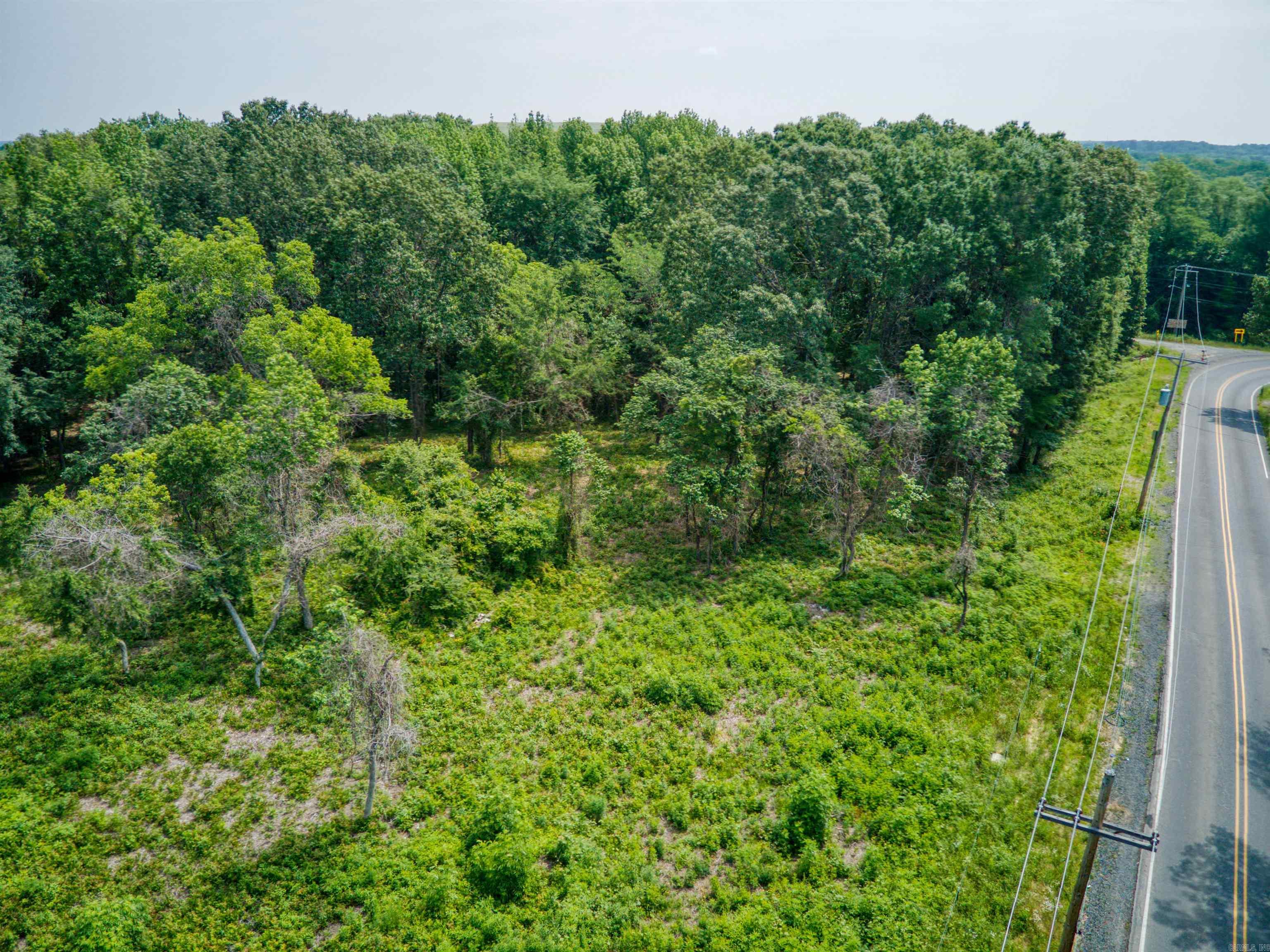 Nice level lot with utilities available on site! With almost 12 acres there is plenty of space to build!! Conveniently located just off the freeway for easy access to all areas of town!