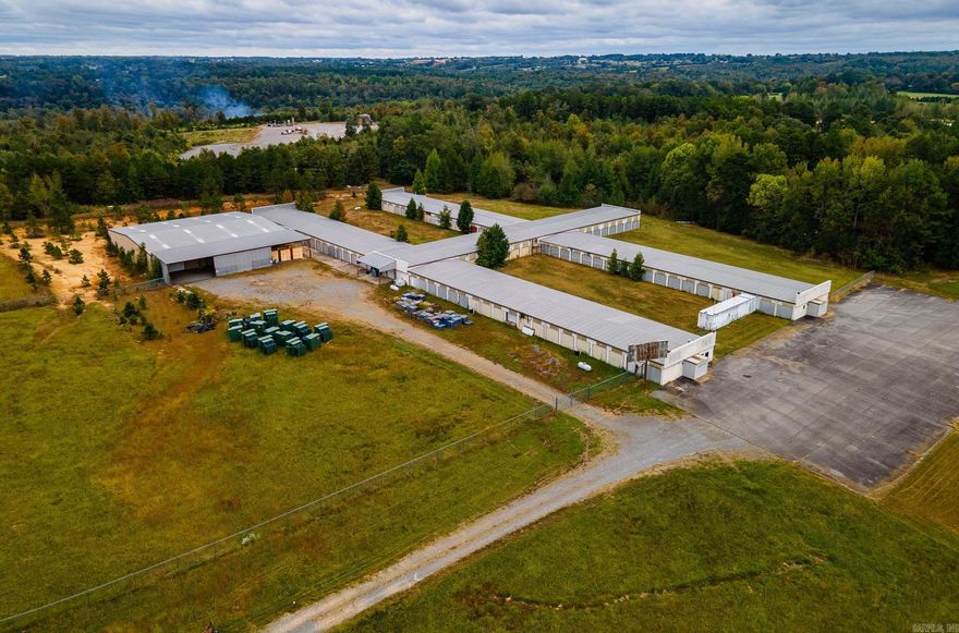 Great Warehouse Opportunity. Come see this 50,000 sf facility that sits on 18 acres. Building 1- is 40,000 sf with 150 roll up doors that with Heat and Air. Building 2- is 10,000 sf offering 18' center height and 14' side walls. This property also includes 18 acres as well as the Billboard at the road of Hwy 65. No mineral rights convey.