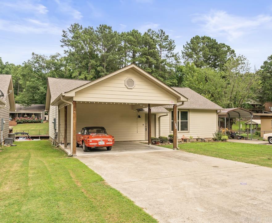 Affordable, Well-Maintained Lake Home with Boat Slip! Tucked away in a serene cove, this 2018-built 3-bedroom, 2-bath home is move-in readyājust bring your boat and fishing poles! With an open floor plan and ample parking, it's perfect for weekend getaways or entertaining friends and family. Enjoy peace of mind knowing your boat is protected year-round with a detached carport, and keep your gear organized in the spacious 12x24 storage shed. Whether you're looking for a full-time residence or a vacation retreat, this property offers the ideal lake lifestyle. All offers will receive a counter at minimum. Move in just in time for the heart of summer and discover why so many are choosing to call Hot Springs home.