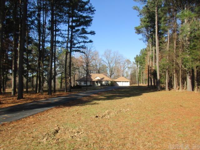 Watch the wildlife around your pond in the morning while you are enjoying your morning coffee.  This beautiful home sits on 3.75 acres.  Home has a split floor plan, large laundry room.  Lots of kitchen cabinets, ss appliances.  Master bathroom has 2 large walk-in closets.  Shop has a concrete floor in main shop with electricity, side shop has lights, big doors.