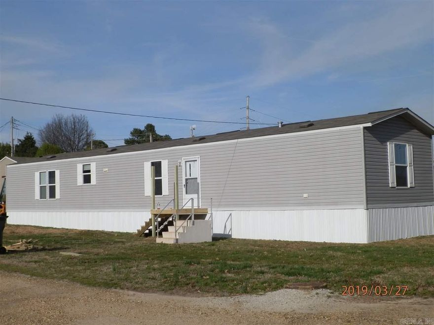 Lease this spacious mobile home. Living room has built in entertainment shelving. Dining area has extra cabinets. Kitchen has pantry and farmer sink. Master bath has dual sink vanity, soaker tub and separate shower. Separate laundry. Stove, fridge and dishwasher furnished. Rent includes water usage. Tenant responsible for all other utilities. No pets. Not currently on HUD Section 8. Application required and  non-refundable application fee charged for tenant screening.
