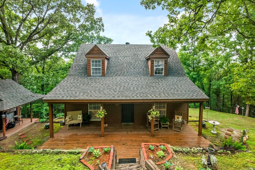 Welcome home to this exquisite cabin in the sought after Country Club area. Over 4 acres of spectacular views, perfect for sipping your morning coffee or reading a book. The main level offers an open concept with large windows and tons of beautiful natural lighting. Two spacious bedrooms and 3 full baths. Wake up to the most amazing scenery in Searcy. Home has had current FHA appraisal. Call for your personal tour today!