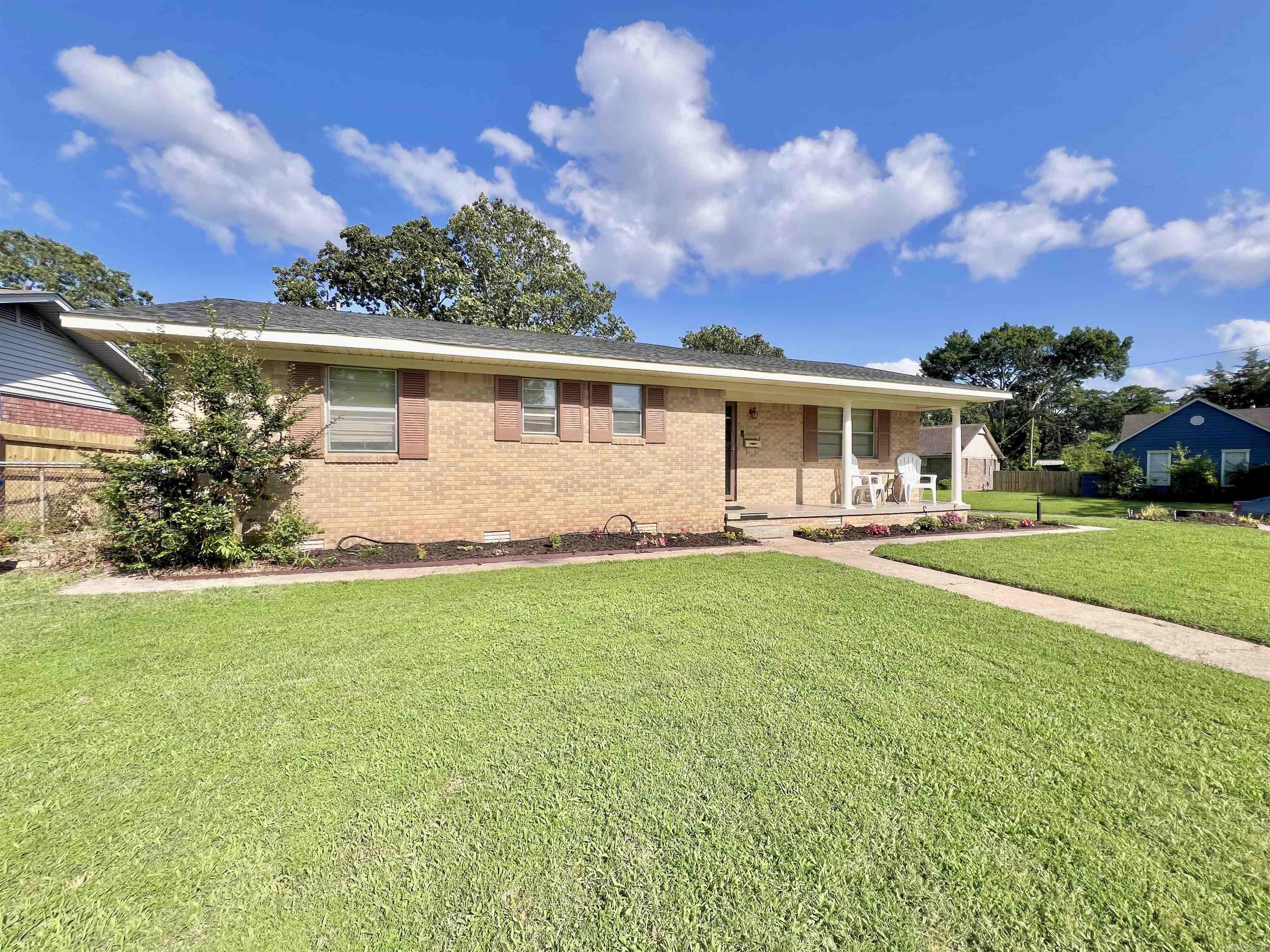Come look at this newly updated home! This conveniently located home sits on a corner lot, has a fenced in backyard with a storage shed. Many updates have been recently done including fresh paint, new flooring, updated kitchen with plenty of cabinets, marble countertops, stainless steel appliances, and more. New roof 2025. HVAC recently serviced. 5600 N Locust offers a spacious open floor plan that is perfect for entertaining or simply giving you the flexibility to do whatever you want with the space. The primary suite was an addition done years ago that is very spacious, offers a walk-in closet and bathroom suite which includes the laundry closet. Low maintenance brick and vinyl siding exterior. Don't miss this opportunity to own a move-in ready home in a desirable location.