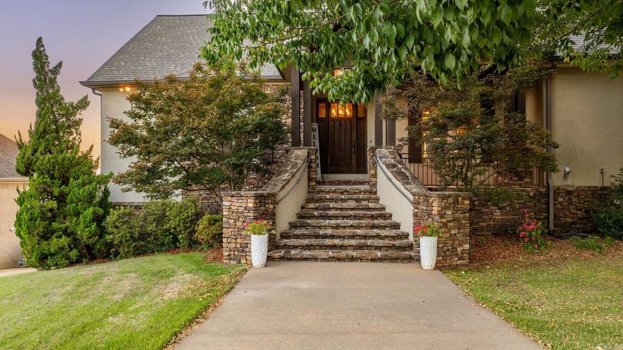 Welcome to this stunning Osage Falls home w/ breathtaking Pinnacle Mountain & river views! Enter the spacious foyer leading to a formal living room w/ coffered ceiling, formal dining room w/ butler’s pantry, separate walk-in pantry, 1/2 bath, & lg laundry room. Designed for effortless 1-level living, the main floor offers 3 bedrooms. The primary suite stands apart w/ spa-like bath, dual vanities, huge walk-in shower w/ 3 heads, & separate walk-in closets. An adjoining room works perfectly as an office, nursery, or flex space. The heart of the home is a spacious living room w/ fireplace & a gourmet chef’s kitchen featuring double islands, double ovens, prep sink, ice maker, gas cooktop, & a sunny breakfast area. The lower level provides flexibility w/ its own living room & fireplace, kitchenette, dining space, 1 bedroom, full bath, 1/2 bath, & FEMA-certified storm/safe room—ideal for guests or an in-law suite. Extras include a heated & cooled 1004 sqft shop w/ bath & work sink, addl garages, climate-controlled storage, RV pad w/30-amp hookup, &circle drive. Out back, enjoy a covered patio w/ fireplace & views. Upgrades: fresh paint, Trex decking, & full security system. A rare find!