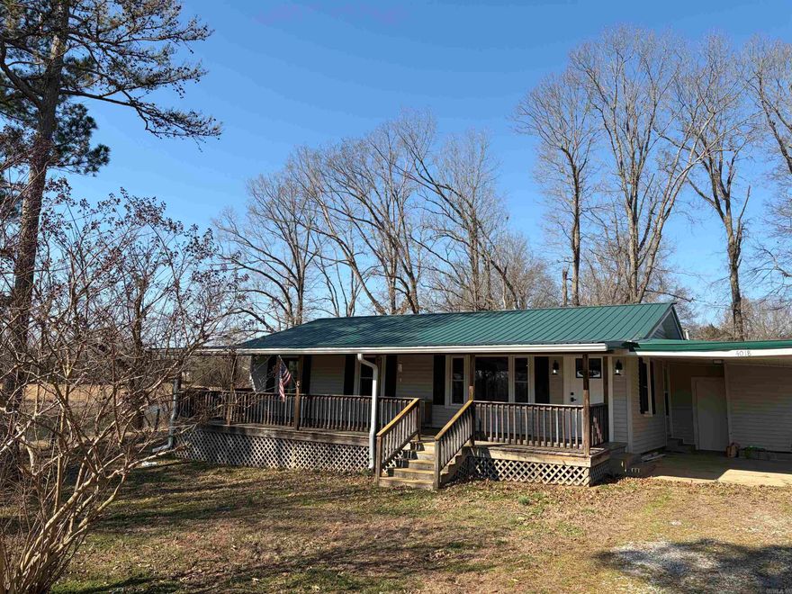 Quaint country living at its finest. This 2-bedroom, 1 bath home has 1040 sqft +\- and sits on approximately .92 acres. Acreage is to be confirmed by survey provided by the seller prior to close. The large living room has beautiful original hardwood floors and provides easy access to the ample sized kitchen and dining area. Third bedroom was converted to an office but could be converted back.  New fixtures throughout the home provide an updated look. The metal roof and maintenance free vinyl siding provide years of service and beauty. New all electric HVAC provides reliable climate control and is supplemented with a backup propane ventless plaque heater. The home is highlighted with a large covered front porch, perfect for enjoying the quiet country setting.