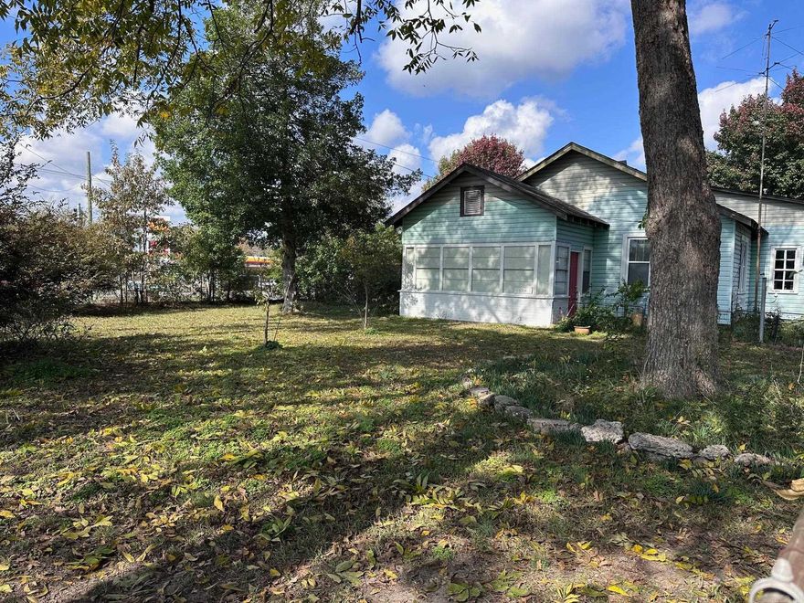 Built in 1939, this house has that old time flair and is well built.  It has a nice spacious back porch for sitting and enjoying your morning coffee while watching the squirrels play in the pecan trees in the backyard.  The backyard provides ample space for flowers and gardening.  This property is zoned for both residential and commercial.  Roof, furnace, and AC were all replaced in 2018.