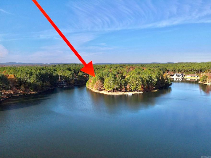 Lake front lot with gentle slope, private pebble beach, and approximately 170' of lake frontage on East side of Hot Springs Village. Located at the end of street on lovely Lake Estrella, which does not receive any golf course run-off water so it's great for swimming! Lot is very close to Granada and Isabella Golf Course. Orientation provides a beautiful, open view of lake. Come build your dream home in Hot Springs Village! New Member Buy-in Fee Due at Closing. See Agent Remarks.