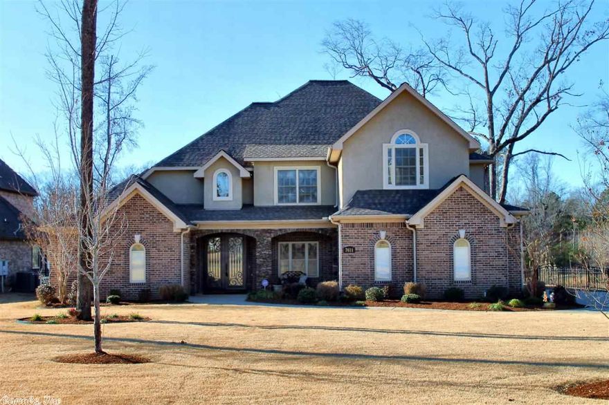 THIS HOME HAS ONE OF THE LARGER LOTS IN THE SUBDIVISION THAT IS LAKE FRONT WITH A BEAUTIFUL VIEW FROM ALMOST EVERY ROOM IN THE HOUSE.THE ENORMOUSLY HIGH CEILINGS ALLOWS FOR MORE WINDOWS TO BRING IN THE LIGHT AND SEE THE VIEWS...A NEW DECK FOR ENTERTAINING SITS RIGHT ON THE WATER...THIS HOME ALSO FEATURES A FIREPLACE IN THE MASTER, KITCHEN SITTING AREA AND THE LIVING AREA...JACK AND JILL BATH FOR TWO BEDROOMS AND ANOTHER FULL BATH FOR THE OTHER BEDROOM AND A BONUS ROOM GIVES THE FAMILY ALL THE ROOM YOU NEED