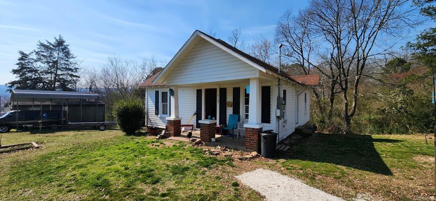Great rental or starter home.  Wonderful location (2 blocks from downtown), new windows and doors, covered front porch and 1930's charm!  See preliminary survey in Associated Document.  The seller intends to keep the minerals.