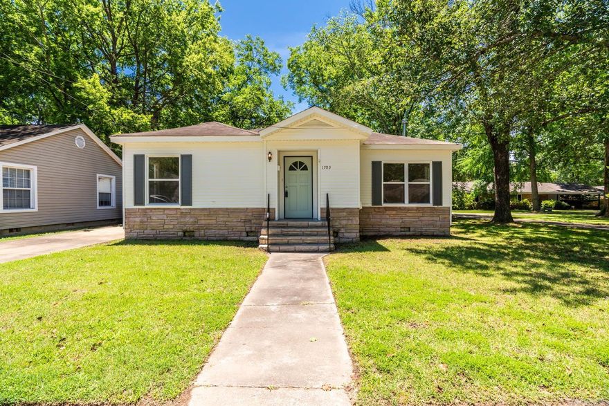 Come check out this beautiful three bedroom, one and a half bathroom home in desirable downtown Conway.  Home sits just steps away from all the downtown shopping and restaurants as well as centrally located to all Conway's college campuses.  Home features luxury vinyl plank flooring throughout the entire home with granite countertops throughout.  Updated lighting and windows throughout make this home have ample natural light in all rooms.  Inside the fully fenced backyard is a large detached block shop measuring 24' x 21'.  Garage door makes for easy access in and out for mowers or even possibly another car.  Washer, dryer and fridge all convey with sale.  Schedule your tour today!  Agents see remarks.