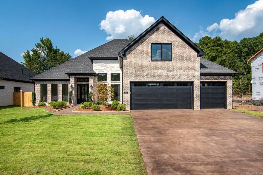 Sold before listed. Fabulous Chenal Valley home with a handsome exterior with brick and limestone accents. This home offers 12 foot ceilings, open level floor plan concept with a formal dining room with 14 foot ceilings, office with french doors, half bathroom and an incredible gourmet kitchen and breakfast room open to the great room. Split floor plan with primary bedroom suite privately located from two additional guest bedrooms on the main level. Upstairs features the fourth bedroom, full bathroom and game room.  Walk-in attic storage. Covered back porch with vaulted ceiling with beautiful wood beams and accents with a fireplace. Located on a level lot which backs up to green space. Three car garage.