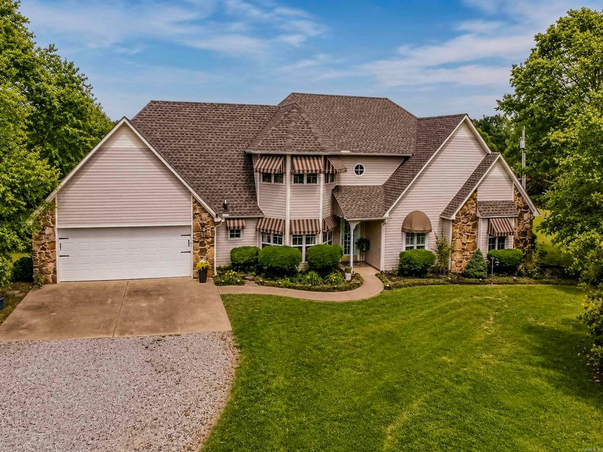 Welcome to this beautiful custom built home (2254 sq. ft.) on 10 manicured acres w/ large barn, with 5 horse stalls, wash bay, office, indoor arena, tack room. There is also an outdoor arena. There is an abundance of beautiful flowers, fruit trees, 2 types of apples, fig trees, crape myrtles, magnolia and so many more. Fenced garden, ten acres of pasture and beautiful yard. House has had exquisite attention to every detail. The master suite is beautiful while at the same time relaxing. Master bath hosts jetted tub as well as walk in shower. Abundance of storage. Your guests will be impressed with the living room, fireplace, and door to the covered patio with breath taking views of the pasture and horses. The upstairs has full bath and2 bedrooms. Call us today for a private tour.
