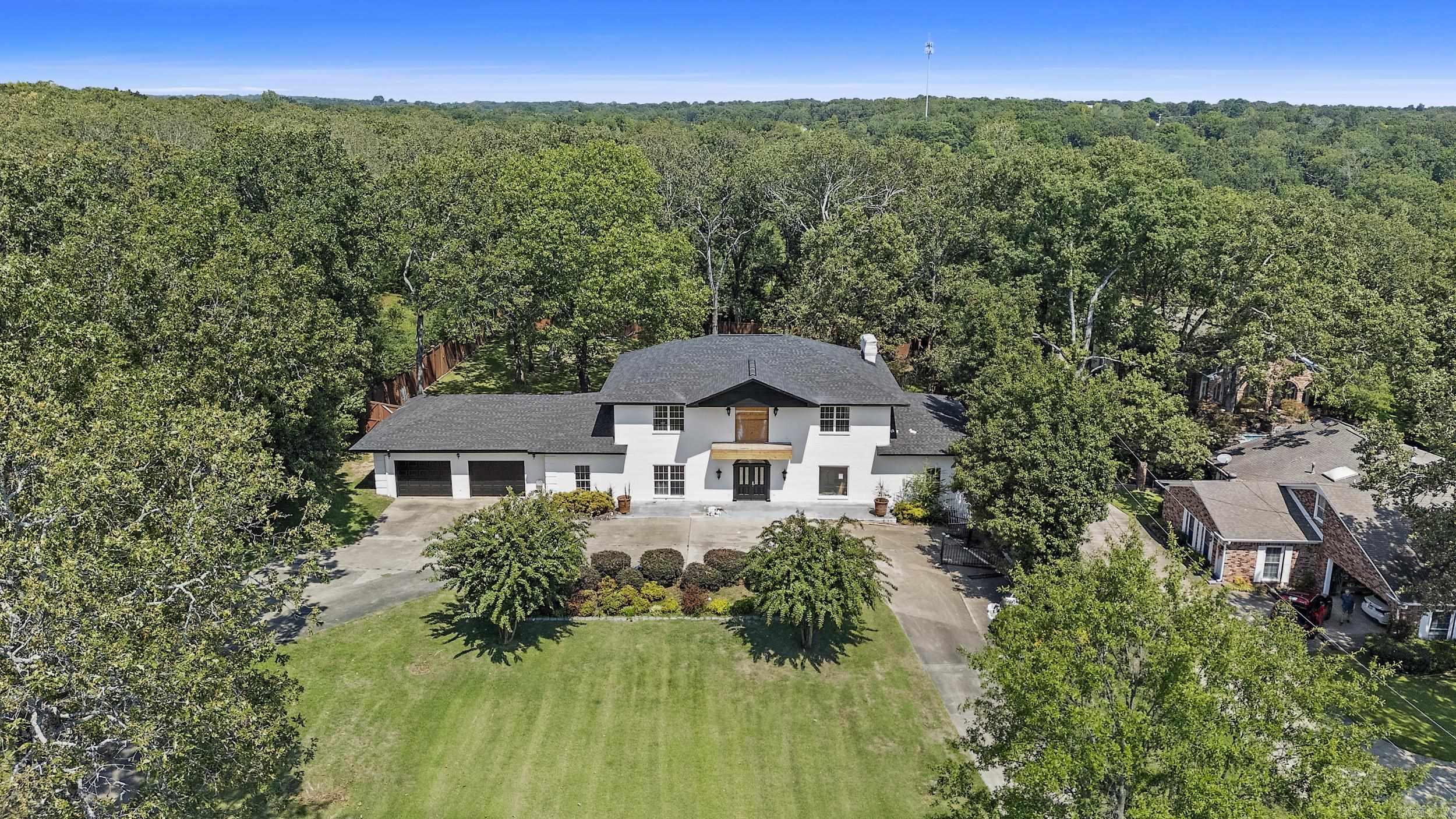 This Wonderful Sherwood Home is a rare find, on approx. 1.10 acres! The Exterior has beautiful updates including New Roof,+New Exterior Paint, New Garage Doors, And the land is level and stunning! Also has a 3 car garage and a Circle Drive. The Inside is an Open Book, for you to create your own dream house. RECONSTRUCTION IS NEEDED FOR THE INTERIOR OF HOME.... It is 3 stories! It also has an elevator in the house to access all 3 levels (which would need to be inspected by buyers) Wonderful back deck overlooks well maintained private back yard. Across the street from Sherwoods Golf Course (The Greens) The layout is there!! This Home is being SOLD AS-IS...No disclosures provided.