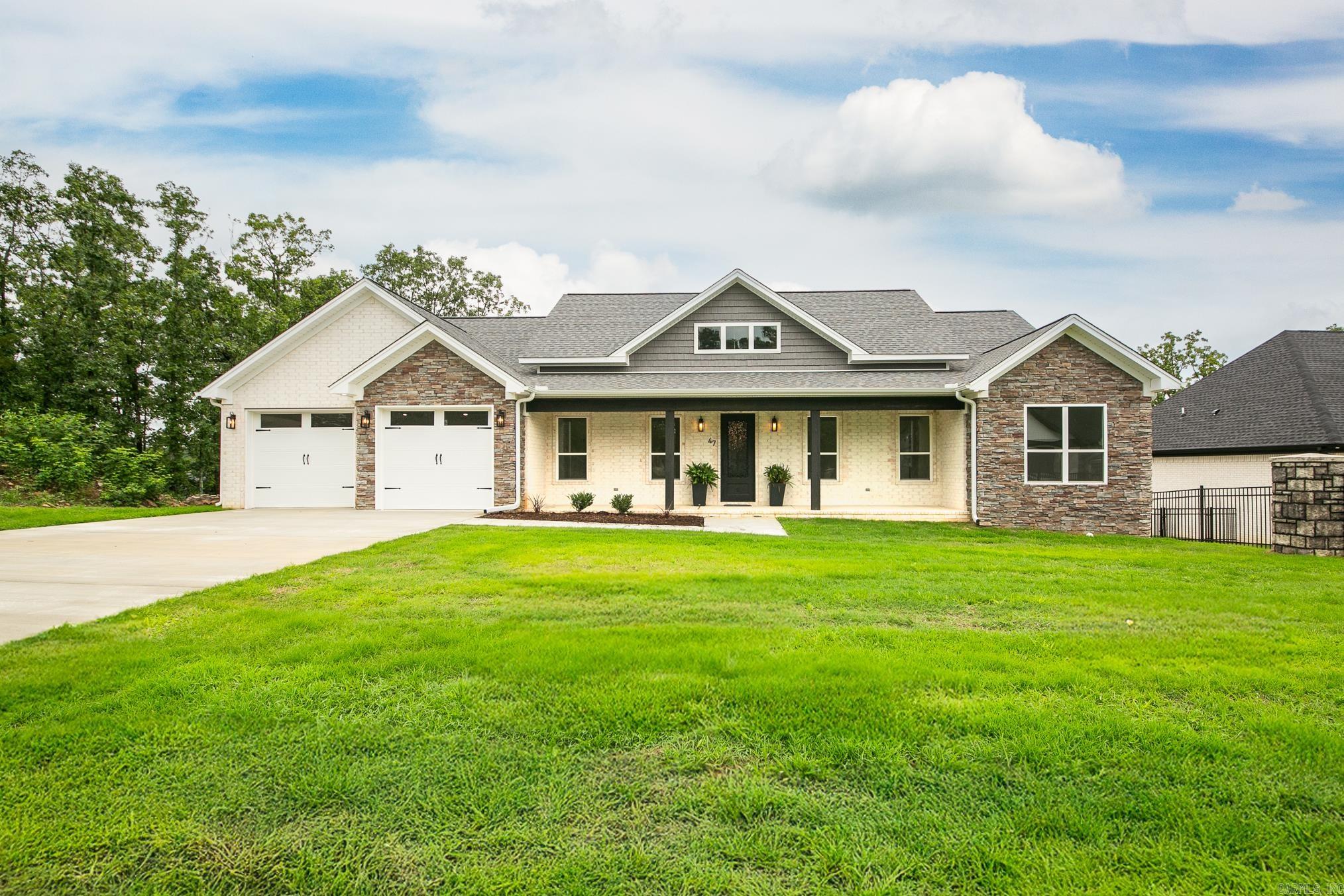 This new construction has everything you dreamed of! 4 Spacious bedrooms and 2-1/2 bathrooms. An open concept, featuring high ceilings and sleek durable floors. The beautiful kitchen is equipped with stainless steel appliances, plenty of cabinet storage, a gas range top, granite countertops, a large island, and a huge walk-in pantry. The master suite is your private retreat, tile shower, free standing tub, and walk in closet. The floorplan offers great flow from the kitchen to the living room. You'll also love the mud room off the garage entry, large laundry room with extra storage, the big back porch with stunning views, and the 2 car garage. This home combines style, comfort, and functionality- everything you need in a perfect living space! All of this nestled in the highly desirable Greystone Subdivision.