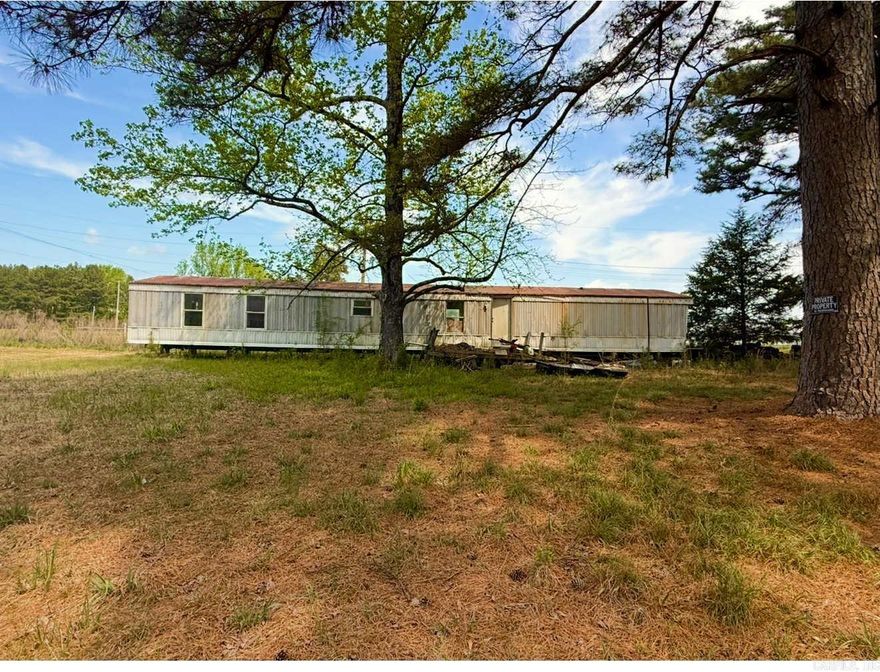 The potential is there!!!!! EIGHT ACRES!!! Fix the mobile and sheds, or build your dreams!