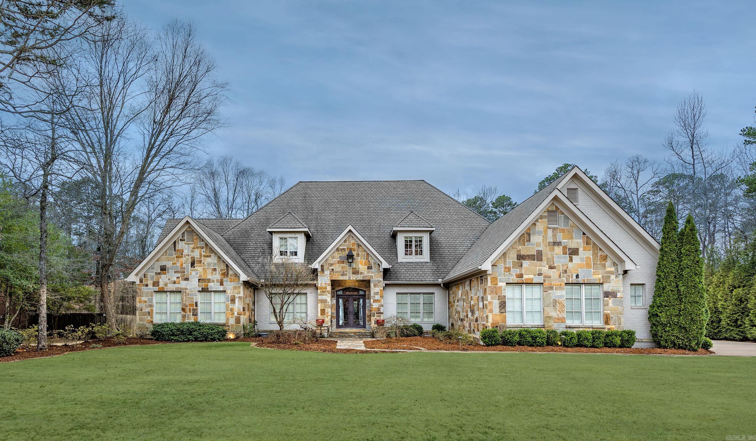 Stunning Home in Prestigious Chenal Neighborhood! This beautifully designed home features 4 bedrooms and 3 full baths on the main level, plus a bonus room, full bath, and entertainment room upstairs—perfect for movie nights or a game room setup. The spacious layout offers comfort and flexibility for everyday living or hosting. Step outside to your private backyard retreat complete with a large in-ground pool, freestanding stone fireplace, outdoor kitchen, and covered patio—ideal for relaxing or entertaining year-round. The oversized primary suite boasts an updated spa-like bath and generous walk-in closet. Located on a quiet street in one of Chenal’s most desirable areas, this home offers both luxury and livability. Don't miss your chance to see this incredible property—schedule your private tour today!