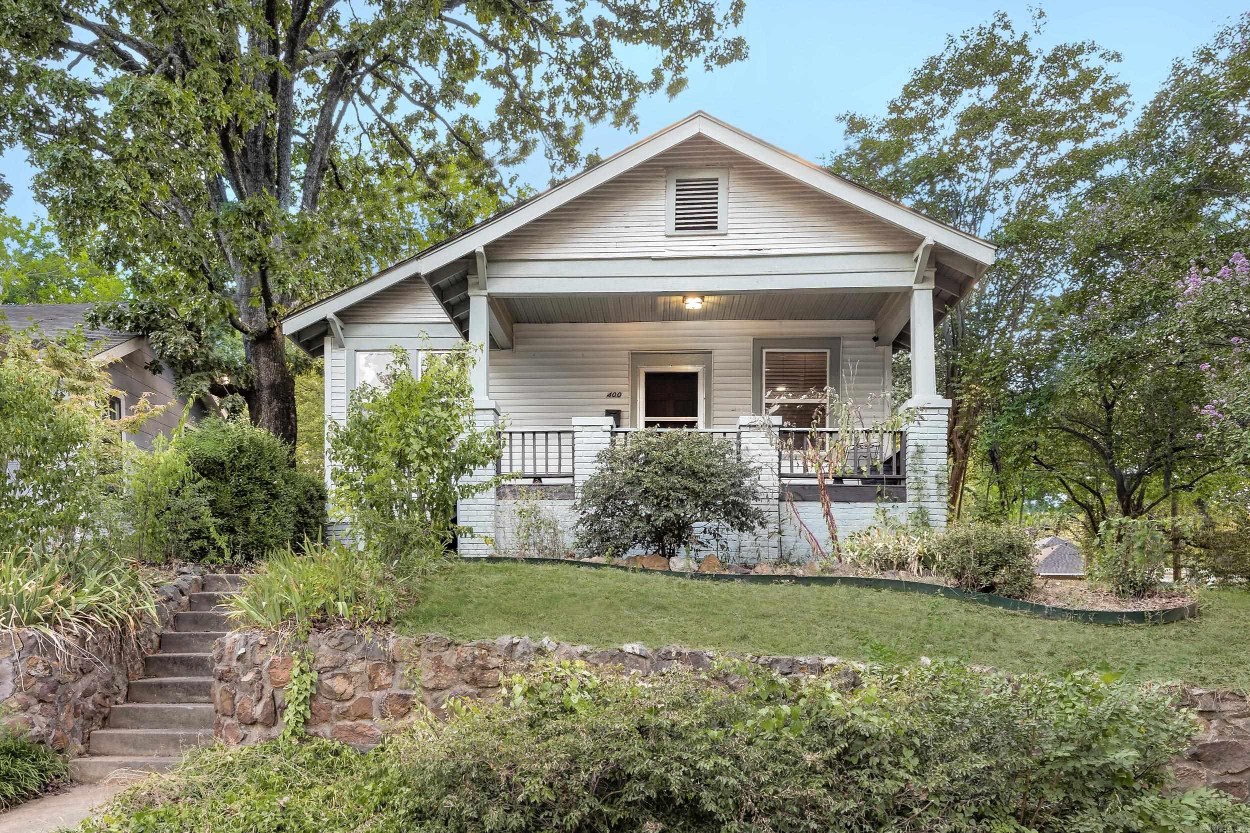 Charming one level on a corner lot with off street parking and fenced backyard. Larger primary bedroom situated on the back of the house. Walking distance to restaurants, or just sit on the front/back porch and enjoy the neighborhood!