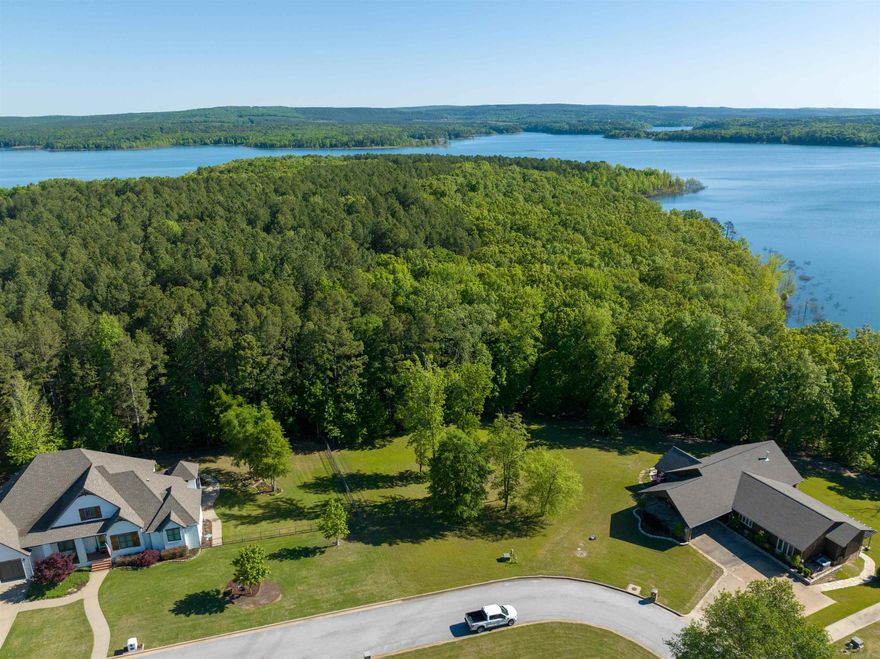 Gorgeous lakefront lot on Greers Ferry Lake. Level lot with beautiful tall trees & a perfect building site. Close to town, but has the feeling of being outside of the city. Boat ramp access is just down the street. Access to Thunderbird Golf Course & Country Club is on the other side of the cul-de-sac. Underground utilities. There aren’t many lakefront lots left in the Heber Springs area, so this is a rare opportunity! See remarks