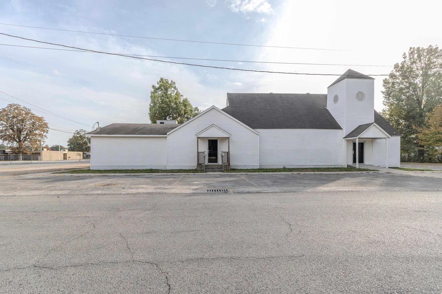 This church building spans 4,397 square feet, offering a spacious and versatile layout. Upon entering, you'll find a large central sanctuary area designed for worship services, with ample room for seating and equipment already in place, including a working baptistry. Off the main sanctuary, there are several multi-purpose rooms that can be used for meetings, classes, or community events. There is also a large meeting space that has dividers that can make the large room into 3 smaller rooms with tables and chairs left by the previous congregation. The church also offers a small kitchen area. This property is currently zoned R-2 and is a total of 2 parcels, including 4 lots. Though this space has been used as a church, it provides for multiple different opportunities. Please reach out for your showing today!