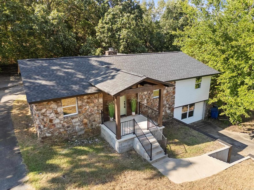 Enjoy golf course living in this fully remodeled home located in the premier heart of west Conway. All-new features include:  -New roof -New electrical system -New HVAC system -New plumbing system -New flooring -New hardware -New deck -New cabinets -New appliances -Newly painted throughout  Situated on an oversized lot directly across from the Conway Country Club, this property provides plenty of space for outdoor entertainment and play. The inside is spacious as well, with a large living area upstairs with a stone fireplace, a spacious dining area, a large master bath with walk-in closet, and over 500 square feet of entertainment space downstairs!   Location, location, location....! This property is located in the highly desirable west side of Conway. It is within a 5 minute drive to much of Conway's best shopping and dining. It is a 3 minute drive to Julie Lee Moore Elementary School, and a 4 minute drive to Carl Stuart Middle School.   Set up a tour today and see if this Conway gem could be your new forever home!  *Living room listing photo has been virtually staged*