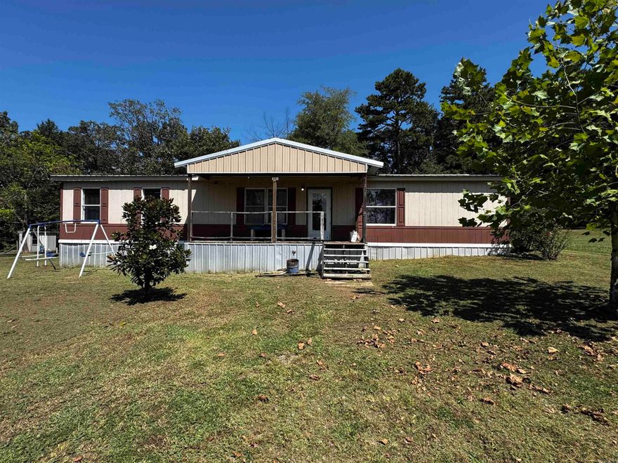 Opportunity awaits - This 4 bedroom 2 bath manufactured home sits permanently affixed on just over an acre of land only 2 miles from the Piney Bay recreational area. Renovations have already begun with a newer metal roof, new drywall, flooring, custom cabinetry, and more - all it lacks are some finishing touches and this home will be move in ready. there are 3 new mini splits heating and cooling the home. On the property there are mature blackberry and concord grape vines, strawberry patches, and mature catalpa trees. There are several outbuildings, one with loft space for added storage. call or text today to view this home.