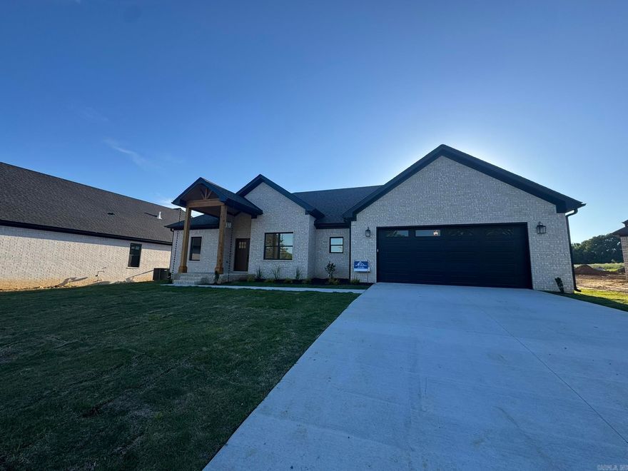 Discover this beautifully crafted new construction by Jacob Moix Construction nestled on a peaceful cul-de-sac in Windridge Estates. This 4 bedroom, 2 bath home offers 2,001 sq ft of smartly designed living space with a split layout that provides privacy and functionality. The open living, dining, and kitchen area creates a warm, inviting space perfect for gathering, entertaining, or relaxing at home. Thoughtful finishes, modern style, and energy-efficient construction make this home both stylish and easy to maintain. The primary suite is a true retreat with a spacious bath, while the additional bedrooms offer flexibility for guests, family, or a home office. Step outside to the covered patio and enjoy the level backyard—ideal for quiet evenings or weekend get-togethers. Conveniently located with quick access to Hwy 67/167, making commutes to Little Rock, North Little Rock, and Searcy a breeze. Just minutes from Cabot schools, shopping, dining, parks, and the Cabot Community Center.  Energy Efficient with Foam insulation on all exterior walls, Zip-board wrap on exterior, Tech Shield roof decking plus so much more!