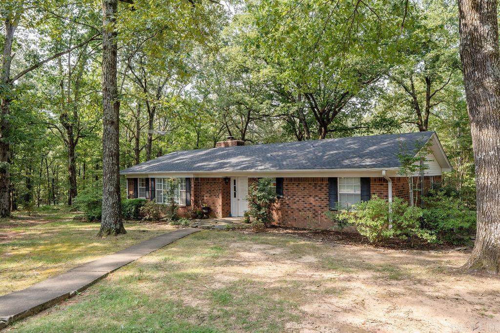 3 Bedroom, 2 Bathroom Home on +/-4.17 acres- Just Outside Searcy! Enjoy the best of both worlds with this charming home located just outside the city limits of Searcy. Sitting on 4 beautiful, tree-shaded acres, this property offers the peace of country living while keeping you close to town conveniences. Inside, you'll find 3 bedrooms and 2 bathrooms, including a spacious living area and a bright sunroom with its own AC unit. The home has been well maintained with several important updates, including a brand new roof for peace of mind. Step outside onto the newly built deck that overlooks the property, ideal for entertaining or simply taking in the serene views. A shop adds even more functionality, giving you space for storage, hobbies, or projects.