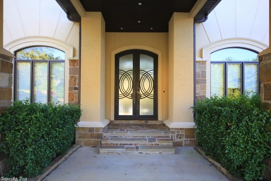 Beautiful Chenal contemporary in gated neighborhood. Two story entry into formal living w/FP & formal dining. Large separate master suite with his & hers baths & closets, bonus/gym & walk thru shower. Large hearth room, guest suite, laundry, office, storage/pantry, office/craft/playrm & dining also on main. Cook's kitchen w/breakfast bar & eating area. Upstairs are 3 bedroom suites, game room, wet bar, media room & bonus area. Outdoor fireplace, sports court and wooded backyard.  Come see!