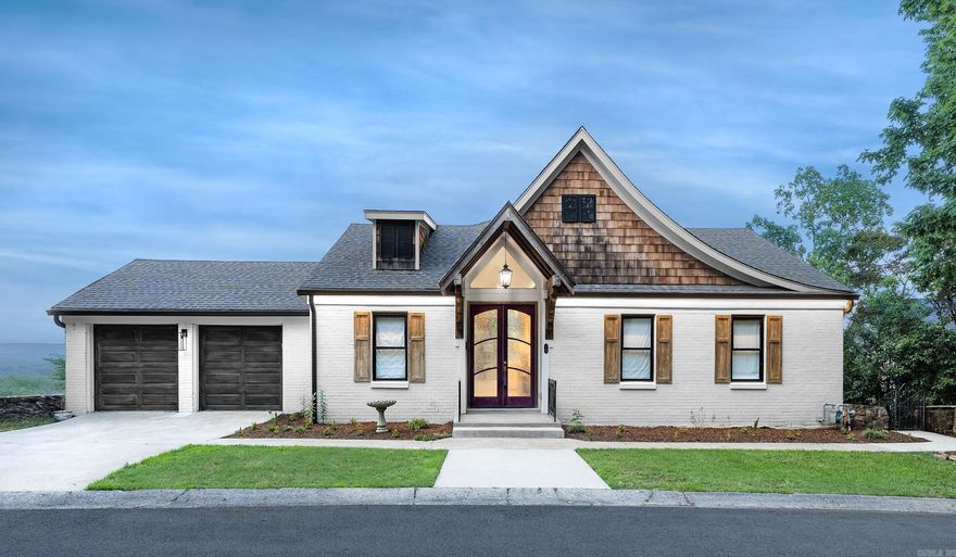 Incredible home with over half an acre lot overlooking the Arkansas River! From the panoramic doors to the soaring ceilings, this is a one of a kind property! Completely reimagined in 2020 down to the studs. Beautiful primary suite with private laundry and covered deck. The second kitchen, second laundry area, two fireplaces, top of the line appliances, second living area and two car garage are just some of the amenities offered here.  Main living area includes open concept living/dining with wet bar and wine refrigerator.  Butlers pantry or second kitchen has sink, dishwasher, second refrigerator and space for a computer.