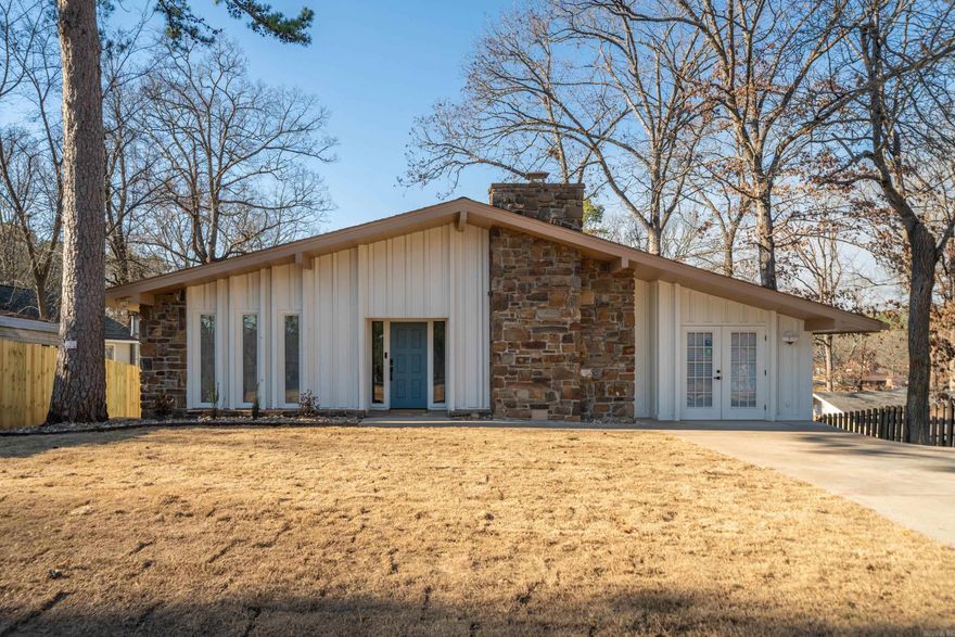 Completely remodeled from top to bottom, this 4-bedroom, 4-bath home features lake Hamilton views and quality updates throughout. Priced under appraised value, you won't find a better bargain on the market. Open the front door and you're greeted with the spacious living area, featuring a true wood-burning fireplace, and stylish LVP flooring, creating a seamless and modern feel. The kitchen showcases gorgeous quartz countertops, stainless steel appliances, and ample cabinet space. You'll love the contractor's attention to detail and custom touches, including modern lighted mirrors, artistic bathroom faucets, sliding barn doors, and accent walls. This home offers incredible flexibility with two en-suite bedrooms on the main level, along with an additional game room/den – ideal for entertaining or relaxing.  The lower level is a fantastic bonus, featuring a separate kitchenette complete with a wine fridge, two additional bedrooms, and a full bath – perfect for guests or multi-generational living. Peace of mind comes with a totally new HVAC system, partial new plumbing/electrical, a new water heater, and a camera security system with thumbprint deadbolts. Don't miss this opportunity!