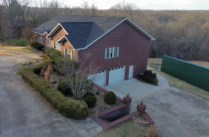 HOME WITH NEW ROOF! This property is outside the city limits, yet close to town. There is easy, paved access right up to the front of the property. Local amenities are nearby, including shopping, dining, a local golf course, and entertainment. This home features a new roof! Inside, is a spacious, open concept living area with a long range view. The kitchen has ample cabinets and storage space, as well as a gas range.   The main floor also includes a large master bedroom with a private bathroom, including a double sink vanity, jacuzzi tub, and separate shower. In addition, there’s a second bedroom and an office area. The deck is accessible from both the living area and master bedroom.  Another asset is the spacious, finished basement, including a full bath and dry bar. There’s also a two-car garage with another room that could be used as a guest room or craft room/workshop. There is plenty of outdoor space to fit your lifestyle, whether that be BBQing, playing games, relaxing, or enjoying the view. There is some fenced-in areas for animals, as well as some wooded areas for hiking.  This property truly has it all, and it's just waiting for you to make it your own for only $359,990.