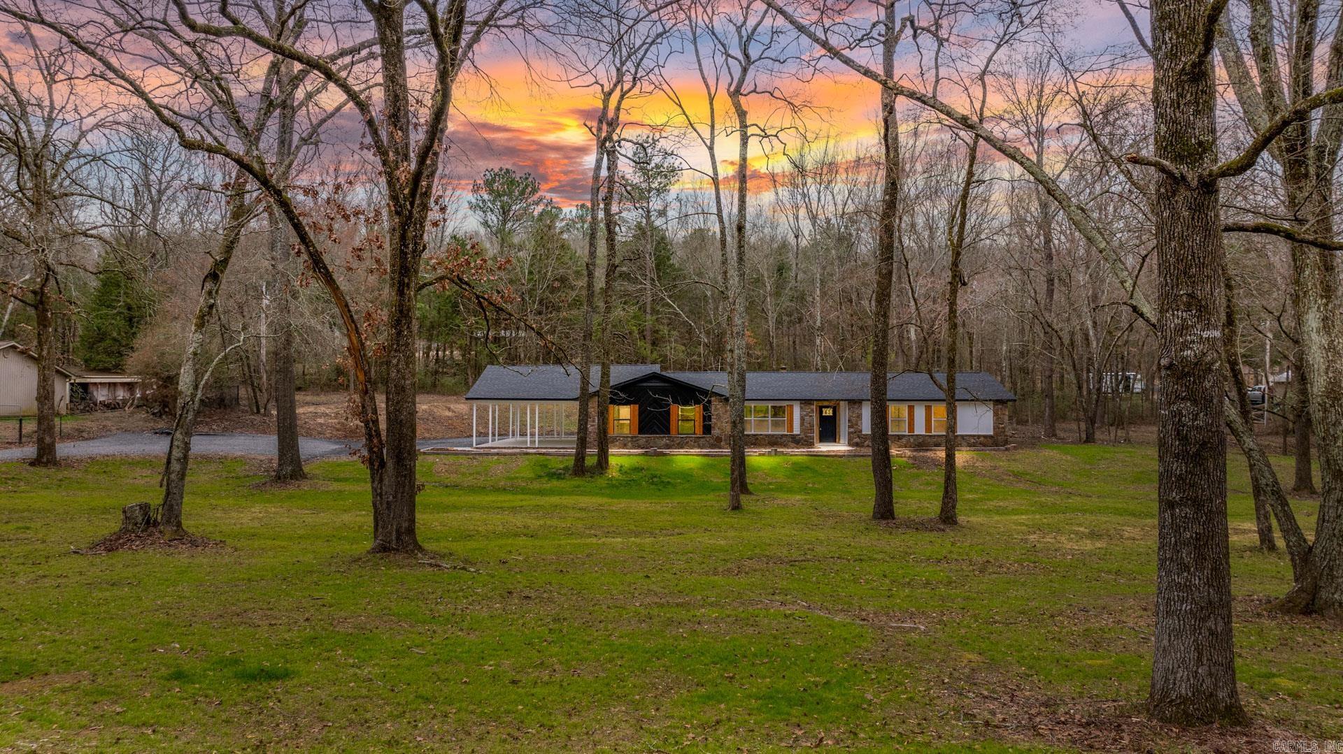 Country settting but close to everything. Totally remodeled home sittting on over an acre of land. This home has two prinmary bedrooom areas. New features and ammenities throughiut. This is a lovely must see like new home.