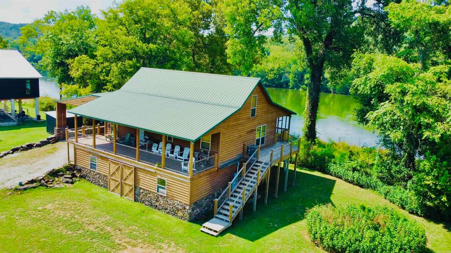 Located in the coveted Ozarks this dream property not only fronts beautiful White River but is just minutes from the music, eateries, & festivals of world renown Mountain View! Quiet & peaceful River Valley offers unmatched sunrise & sunset views, excellent trout fishing, plus a boat launch. Enjoy watching eagles, deer, otters, & geese from  back porch or while BBQing in the outdoor kitchen followed by star gazing around the large outdoor stone fireplace. The well-designed cabin is raised with a river rock filled concrete block foundation, slab floor, & ceiling offering a large unfinished area plus a 10–12-person safe room. The main floor has a timeless rustic cabin feel, open concept design, warm rich wood, vaulted wood ceiling, windows with views, & a large stone fireplace in the Great Room. The staircase to the loft's landing is a show piece leading to a spacious bedroom or bonus room with bath. The primary bedroom has a river view, small fireplace, & door to the covered back deck. With over 100ft of private White River frontage, well maintained, recent roof, plumbing, flooring, deck updates, it's a dream property perfect for families, retirees, or an ultimate vacation getaway!