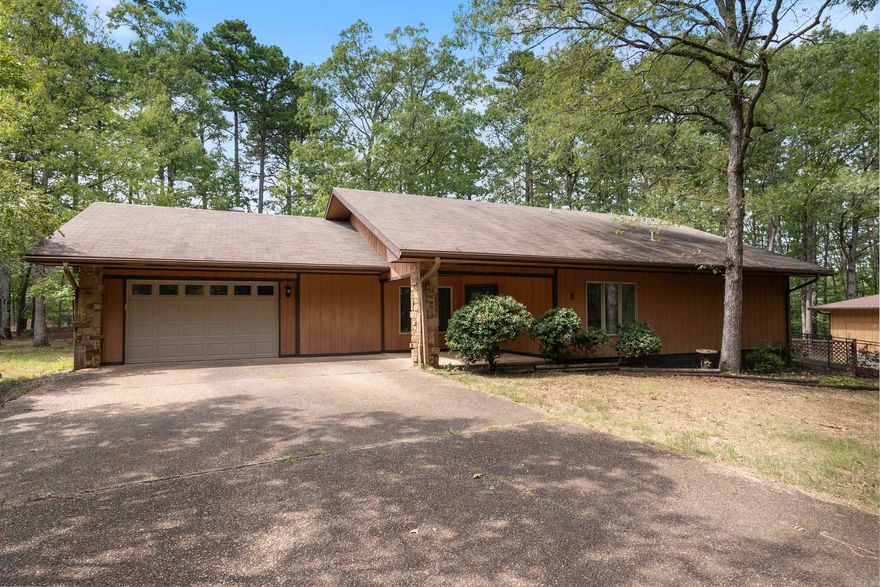 Welcome home! This 3-bedroom, 2-bath home is close to the west gate and features an open floor plan with fireplace and NEW FLOORING (Oct. 2024) and NEW ROOF (Nov. 2024)! Features include a formal dining room, eat-in kitchen with new stove and dishwasher, refrigerator, washer, and dryer. The master bath has a walk-in shower and tub with shower. This home has new mini-blinds, recessed lighting, and fans. Additional features include a garage with a workbench, a closed-in room for storage or an office, and a covered back porch wired for a hot tub. Handicapped access is available! Located on a dead-end road, this home offers convenience and serenity. Renovations in 2021 include new flooring, light fixtures, appliances, paint, toilets, and mirrors and a new HVAC installed in 2023! Schedule your showing today!