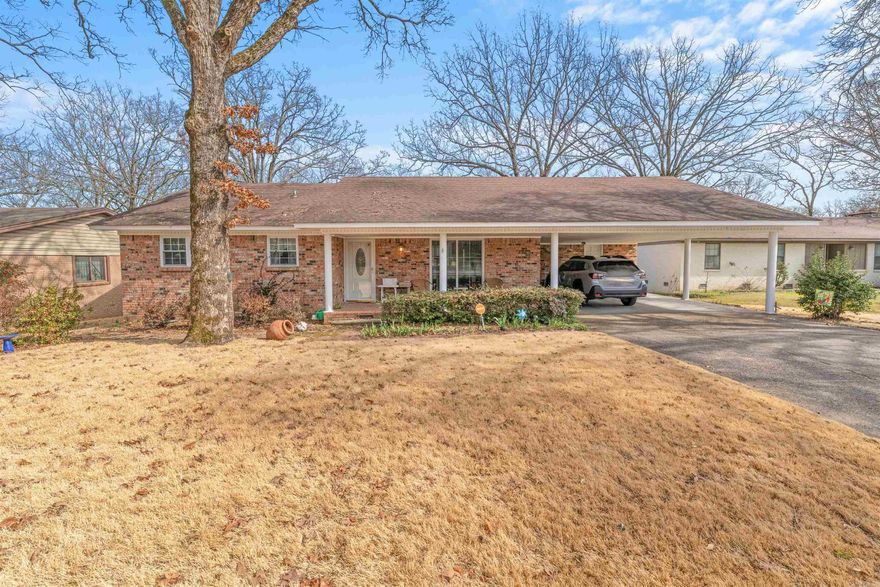 This is a lovely home located in the heart of Sherwood.  The kitchen has been updated several years ago.  The cook will love all of the cabinetry and counter space.  There is a double over and gas stove top and you have to love a window over the sink.  In the kitchen you will also find a breakfast bar, space for a table and a hearth room with a gas fireplace.  There are 3 bedrooms and 2 bathrooms.  There is laminate flooring throughout (no carpet).  The bathrooms have also been updated in the past few years.  The ensuite offers a shower and the main bath has a handicap tub/shower combo.  There is a deck overlooking the backyard.  There is also a small shop/shed in the backyard with electricity.  This home is perfect for a first-time homebuyer or someone looking to downsize.  The exterior is all brick and has a double carport.  Call today for a showing.