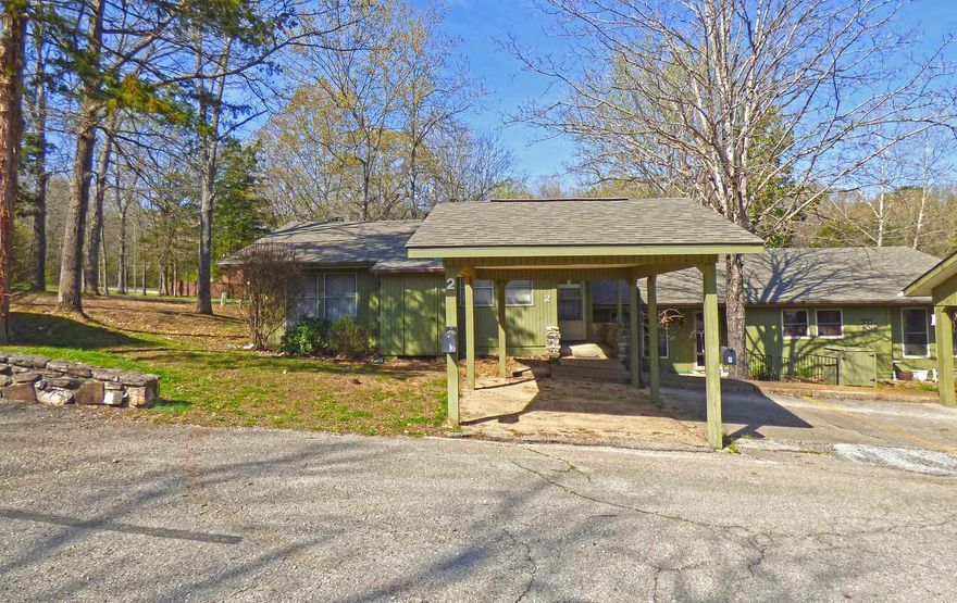 One Level Townhouse in a semi secluded location. This townhouse offers 2 bedrooms, 2 baths, living room with a wood burning fireplace, kitchen, utility room, sunroom or bonus room, Central Heat Pump, and carport. All located within walking distance to the indoor swimming pool and close to the Cherokee Village Town Center. All this is on one-level and someone else take care of your lawn.