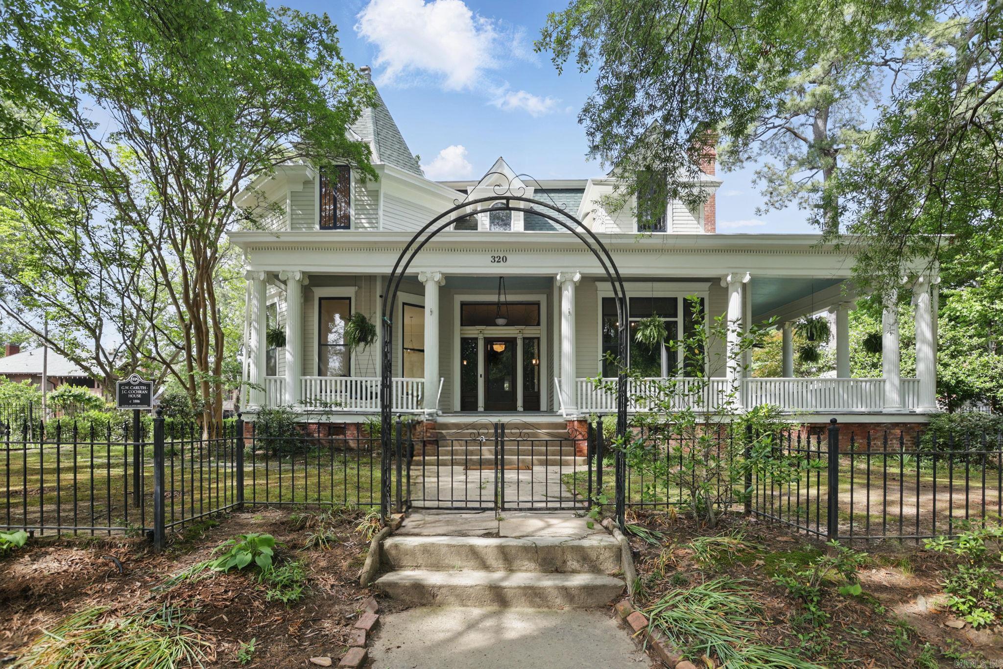 Step into the elegance of the Caruth-Cochran House, a historic gem circa 1882, meticulously renovated with modern luxury. Located on three oversized lots across from the Governor's Mansion, this home features a gated circle driveway, 16x40 swimming pool, and wrought iron fencing. Inside, 14-foot ceilings and original woodwork set the tone, with four bedrooms and four-and-a-half bathrooms, including primary bedrooms on both the main floor and upstairs. The spacious layout offers multiple living areas, perfect for entertaining or relaxed living. The chef's kitchen boasts Z-Line gas stove, double dishwashers, walk-in pantry, and a pot filler. The wet bar includes an ice maker and dual-zone mini fridge, ideal for poolside fun. Own a piece of Little Rock history-featured on the Quapaw Quarter Association's 2022 Spring Tour of Homes-offering the perfect blend of historic charm and modern amenities.