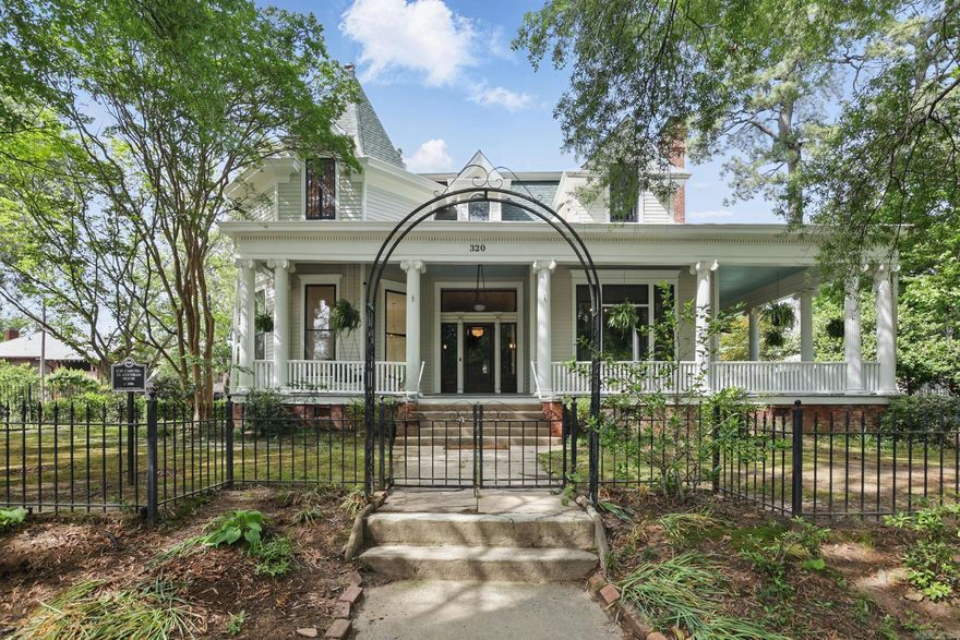 Step into the elegance of the Caruth-Cochran House, a historic gem circa 1882, meticulously renovated with modern luxury. Located on three oversized lots across from the Governor's Mansion, this home features a gated circle driveway, 16x40 swimming pool, and wrought iron fencing. Inside, 14-foot ceilings and original woodwork set the tone, with four bedrooms and four-and-a-half bathrooms, including primary bedrooms on both the main floor and upstairs. The spacious layout offers multiple living areas, perfect for entertaining or relaxed living. The chef's kitchen boasts Z-Line gas stove, double dishwashers, walk-in pantry, and a pot filler. The wet bar includes an ice maker and dual-zone mini fridge, ideal for poolside fun. Own a piece of Little Rock history-featured on the Quapaw Quarter Association's 2022 Spring Tour of Homes-offering the perfect blend of historic charm and modern amenities.