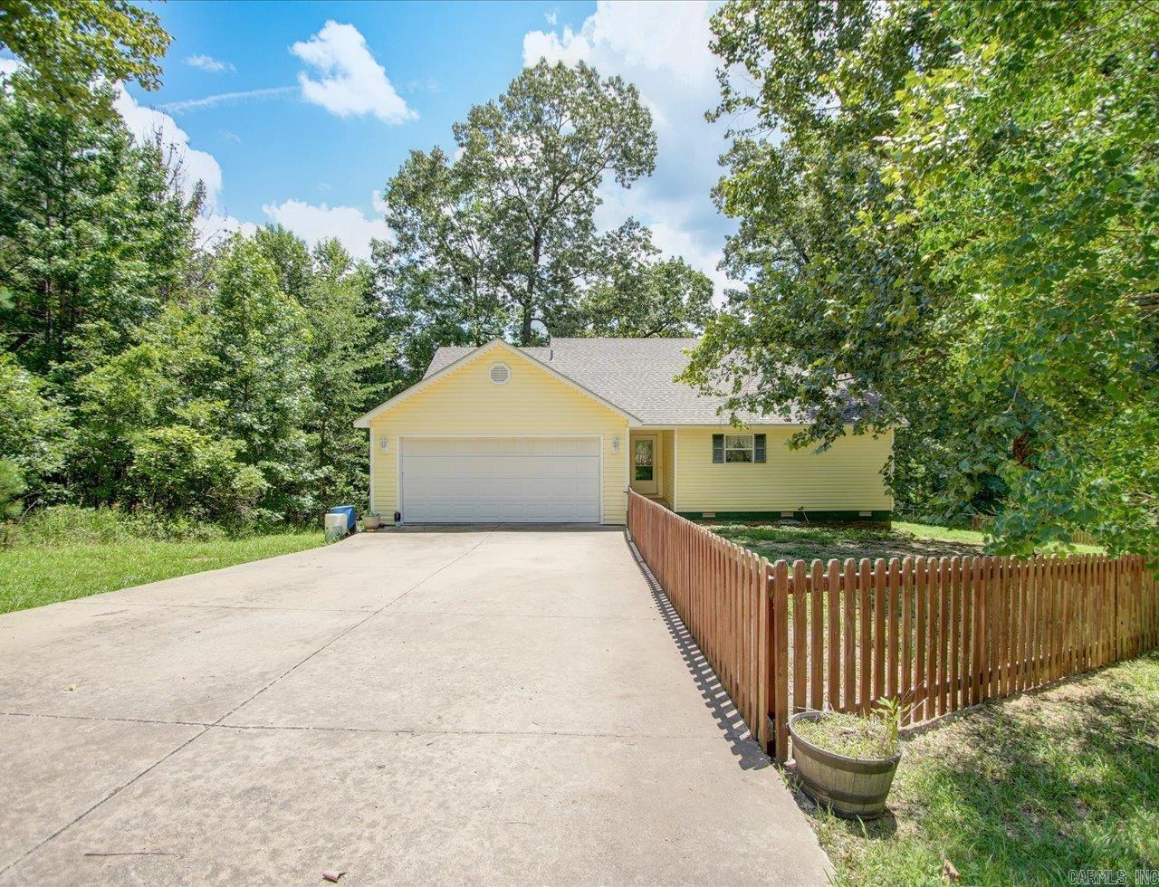 Welcome to resort-style living in the heart of Diamondhead – a tranquil, gated community just 20 minutes from Hot Springs, tucked along the shores of Lake Catherine. This cozy 3Bd/2Ba home perfectly blends modern comfort with country serenity, offering the ideal retreat for families or those seeking a peaceful lifestyle with premium amenities. The primary bedroom features a walk-in closet & private bath. Enjoy your morning coffee or al fresco dinners on the covered back deck. Spacious 2-car garage on a generous ~0.4-acre wooded lot, maintaining the peaceful ambiance of the neighborhood. Diamondhead amenities include an 18-hole PGA-certified golf course & clubhouse/restaurant, community pool, tennis & pickleball courts & playground, boat launch, marina & lake access to Lake Catherine. Plus there's miles of hiking in Lake Catherine State Park conveniently located close-by. With top-rated Lakeside schools & easy access to Hot Springs’ shopping, dining, and medical facilities, this lifestyle offers a rare blend of leisure and convenience.