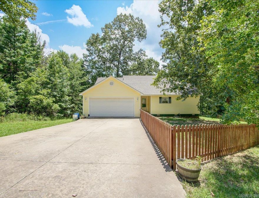 Welcome to resort-style living in the heart of Diamondhead – a tranquil, gated community just 20 minutes from Hot Springs, tucked along the shores of Lake Catherine. This cozy 3Bd/2Ba home perfectly blends modern comfort with country serenity, offering the ideal retreat for families or those seeking a peaceful lifestyle with premium amenities. The primary bedroom features a walk-in closet & private bath. Enjoy your morning coffee or al fresco dinners on the covered back deck. Spacious 2-car garage on a generous ~0.4-acre wooded lot, maintaining the peaceful ambiance of the neighborhood. Diamondhead amenities include an 18-hole PGA-certified golf course & clubhouse/restaurant, community pool, tennis & pickleball courts & playground, boat launch, marina & lake access to Lake Catherine. Plus there's miles of hiking in Lake Catherine State Park conveniently located close-by. With top-rated Lakeside schools & easy access to Hot Springs’ shopping, dining, and medical facilities, this lifestyle offers a rare blend of leisure and convenience.