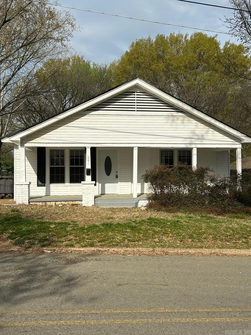 Adorable renovated craftsmen style home with front porch, new roof, lots of new updates and remodeled items, new countertop and stainless appliances. Plumbing water lines upgraded. Original Hardwood floors refinished, new lighting, new exterior doors, walk in shower, all located on a corner lot. Nice enclosed backporch has a Bonus area off laundry area could be office, craft room or walk in pantry.  Close to downtown and schools.