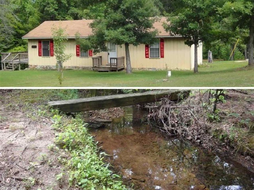 WOW!! 105 wooded acres m/l with STRAWBERRY RIVER frontage, creek meandering thru near house. Roomy 2 bedroom home & 40 x 30 METAL SHOP with 3 overhead bay door, concrete floor, & bathroom. Home is approx 1300 sq ft, features central heat & air, 2 bedrooms both with large closet, 1.5 baths, extra large living room, good kitchen with range and refrig and big decks covering creek and backyard! Well & septic. Approx 2 1/4 miles on gravel rd, perfect location for getting away from it all & for hunting!