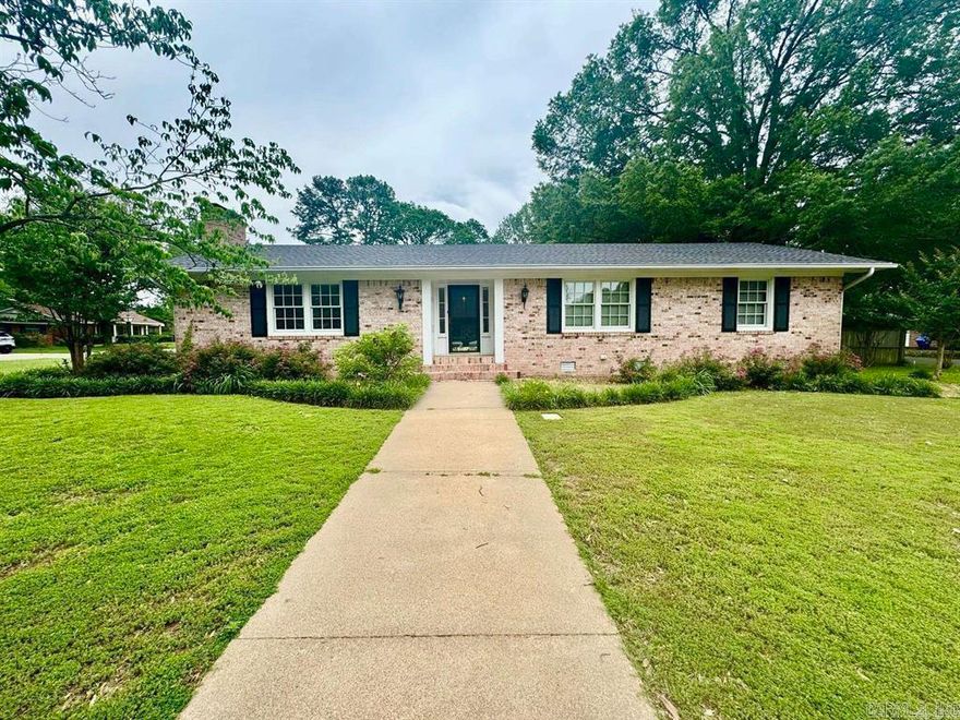 LOCATED RIGHT IN HEART OF CONWAY Great family home, makes great rental since its walking distance  to UCA and Conway Regional and has been a successful AIR BNB.  The home has two living areas one is a sunroom with lots of naturual light which would make a great art Studio  and the other has a cozy fireplace. The Floors are original, beautiful legit wood. The home sits on a rare lot that has corner lots on both ends. This home has a ton of storage inside and outside. The garage has two storate rooms in it, one is heated and cooled.There is an outside shop with elec.  The wooden deck overlooks a natural, peaceful landscaped area to help you unwind. A unusual pull through drive from Timothy to Rebecca and makes great parking for  your trailer or RV ROOF REPLACED SOMETIME IN 2023, THERE ARE TWO HVAC units, Sprinkler system. AGENTS SEE CONF REMARKS